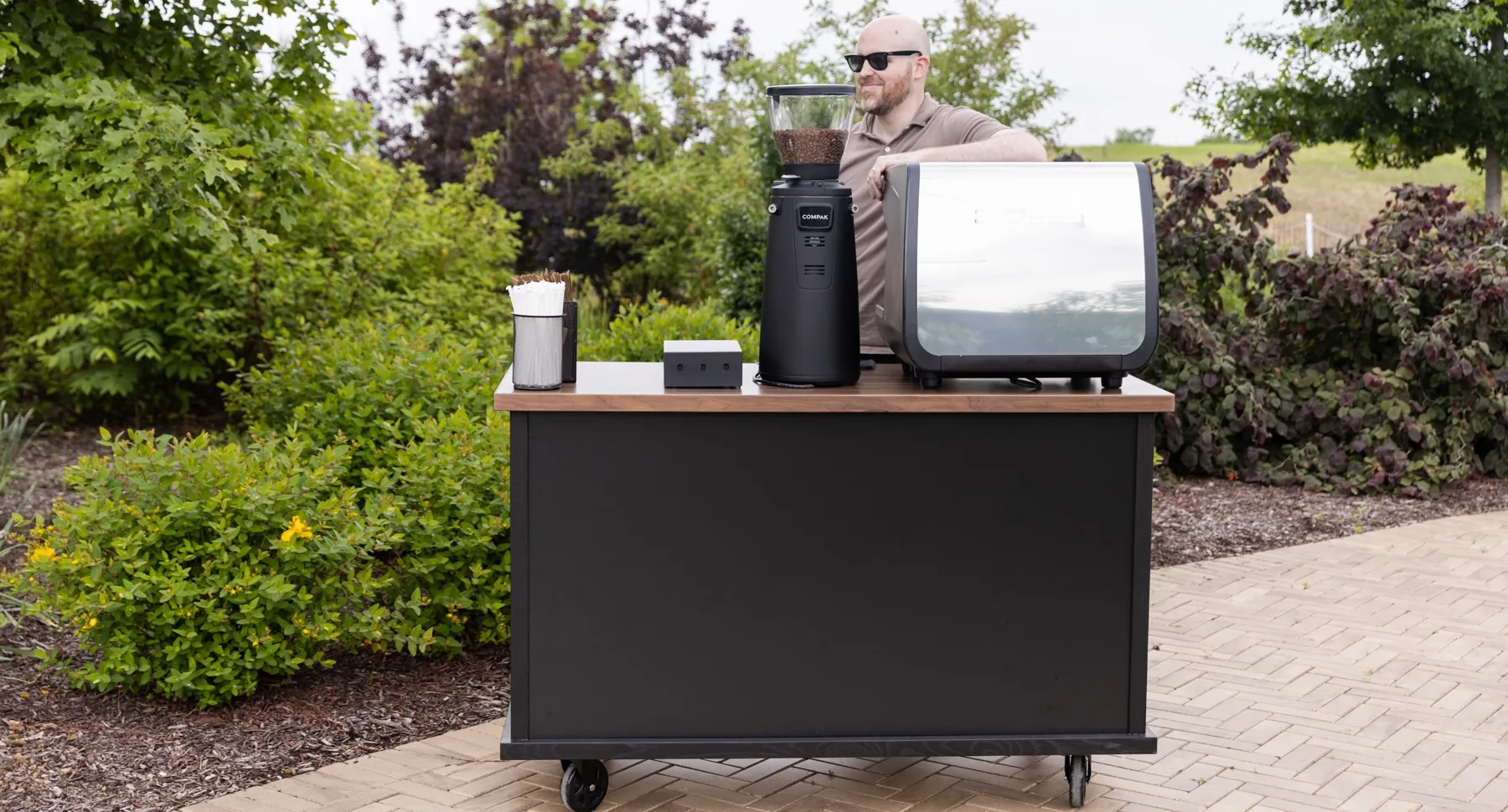 My Town's Café mobile espresso cart set up at an elegant outdoor wedding